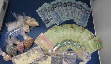 Drugs and cash seized after a search on Park Street in Chatham. (Photo courtesy of Chatham-Kent police)